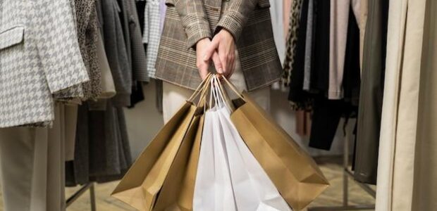 close-up-hands-holding-shopping-bags