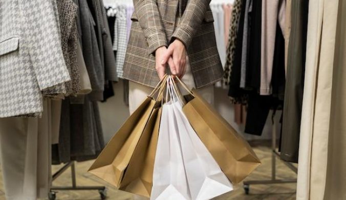 close-up-hands-holding-shopping-bags