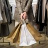 close-up-hands-holding-shopping-bags