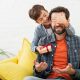 lovely son making a surprise to his father