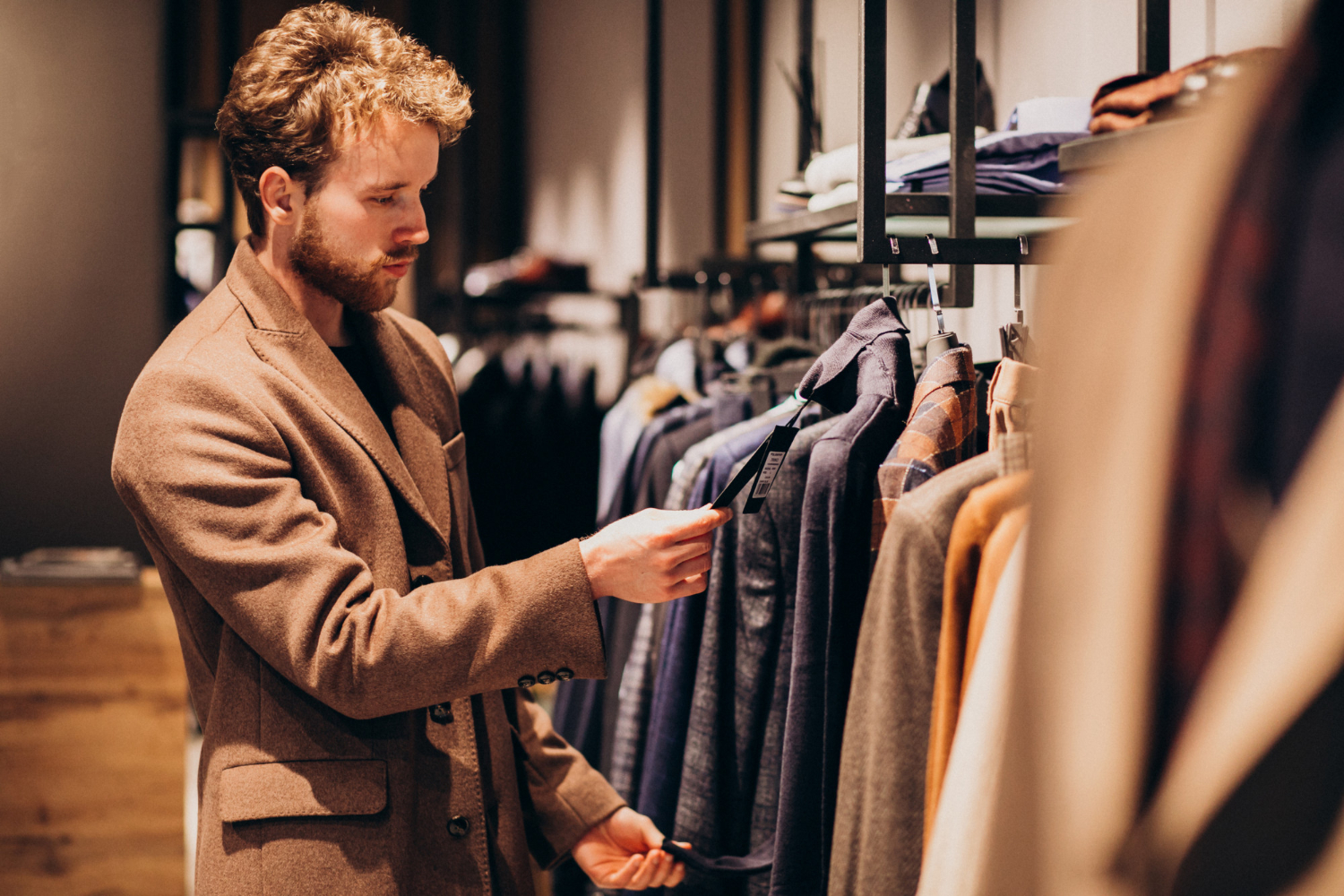 man-choosing-clothes-shop