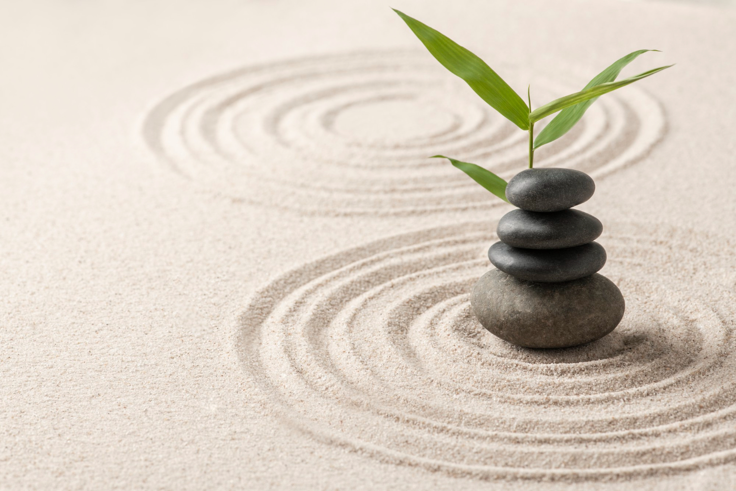 stacked-zen-stones-sand-background-art-balance